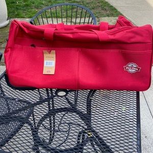 First Class 26” rolling duffel bag NWT
